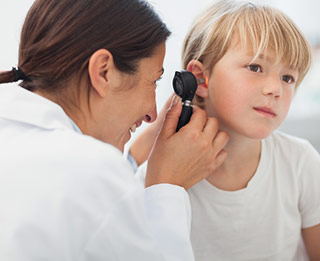 doctor examining child